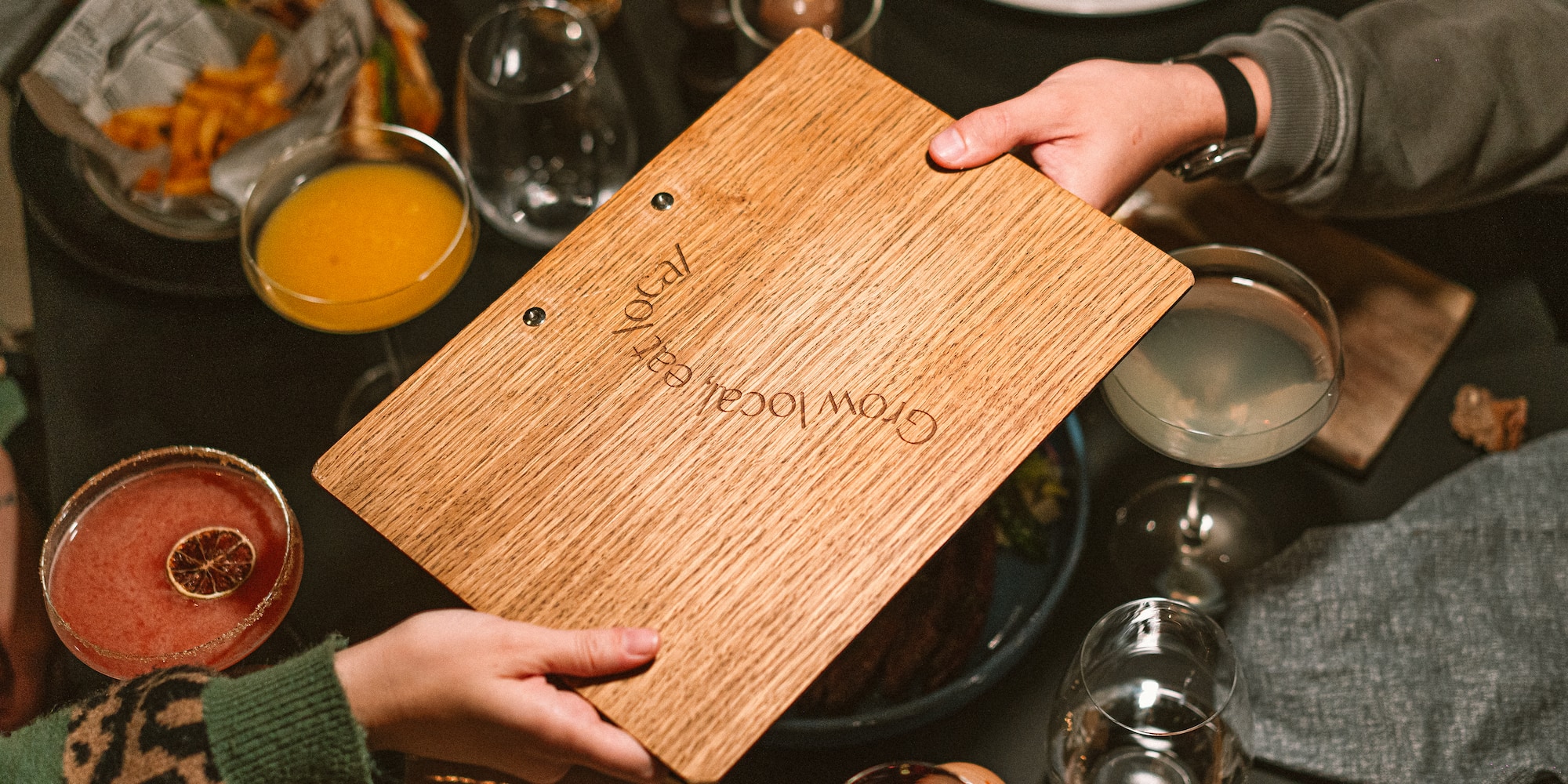 a person holding a wooden board