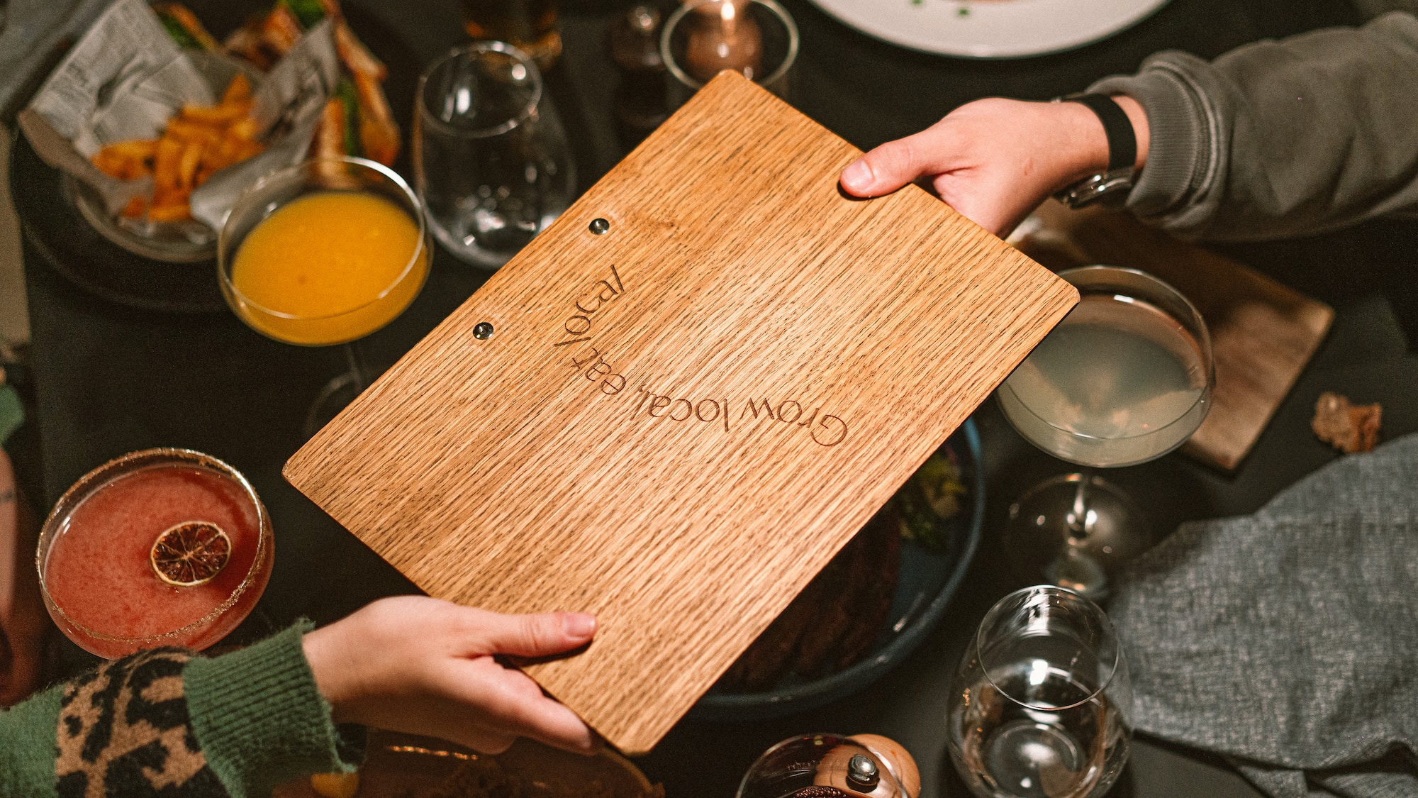 a person holding a wooden board