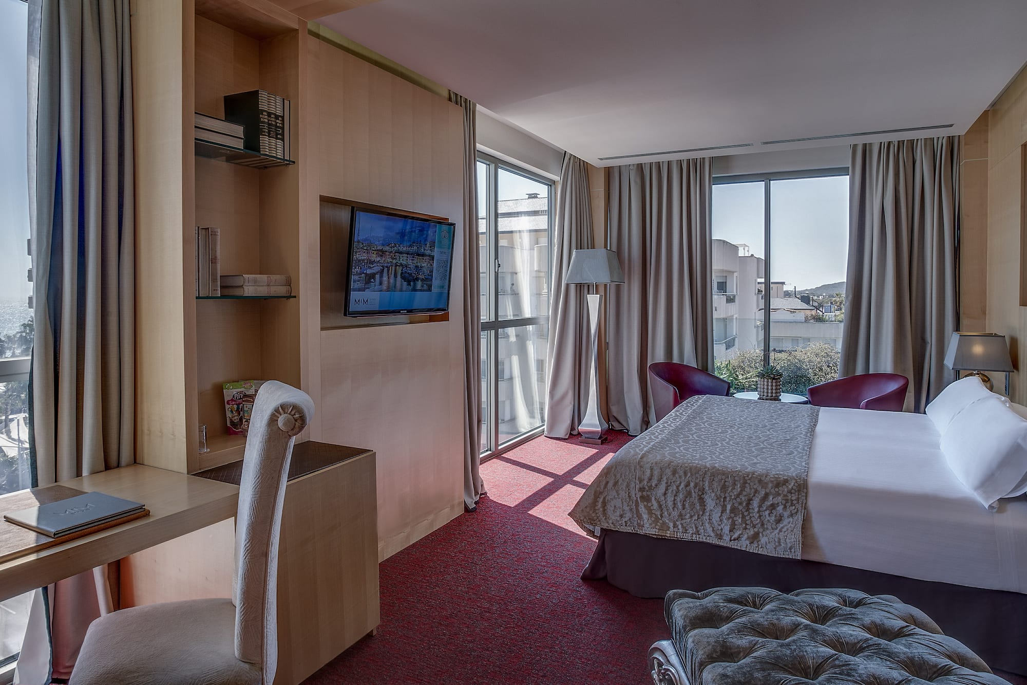 a room with a bed and a television