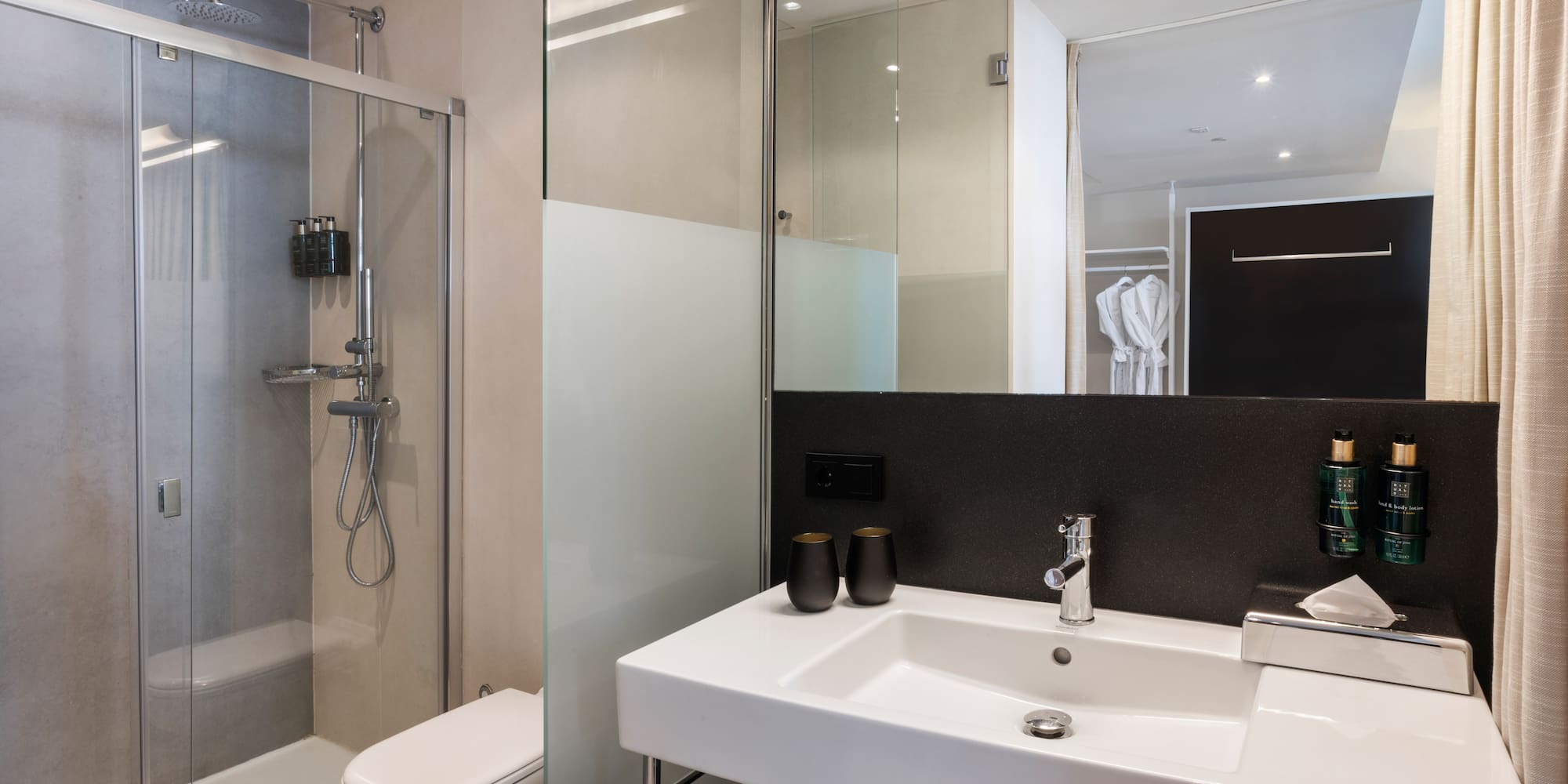 a bathroom with a shower and sink