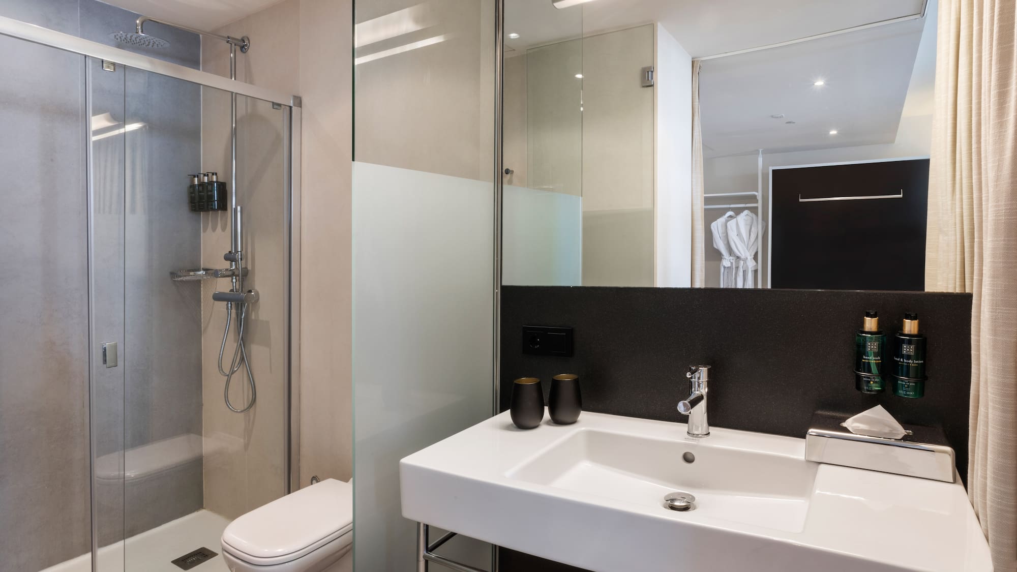 a bathroom with a shower and sink