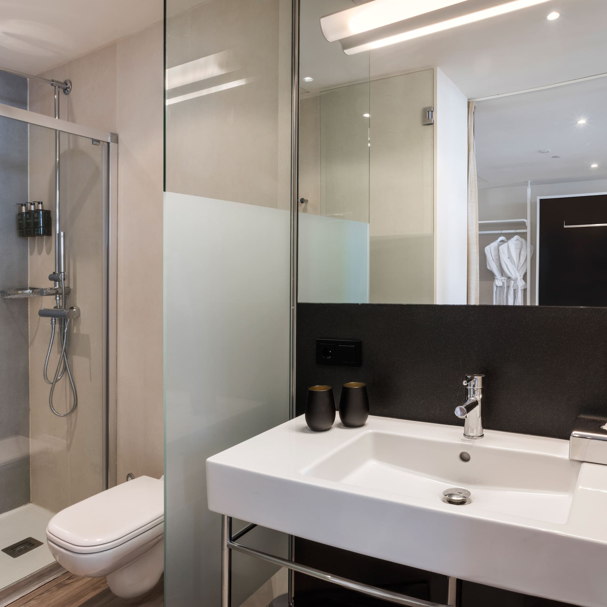 a bathroom with a shower and sink