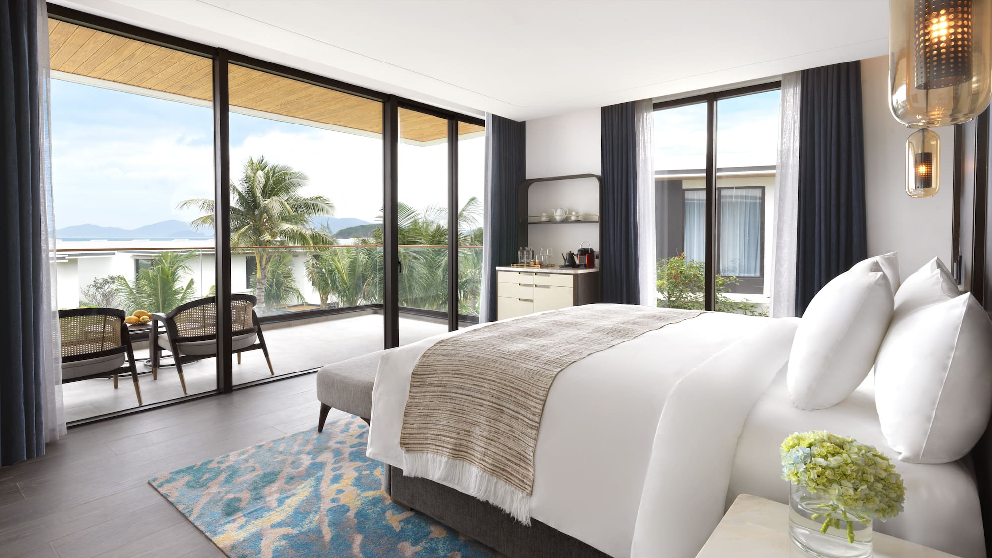 a bedroom with glass doors and a bed