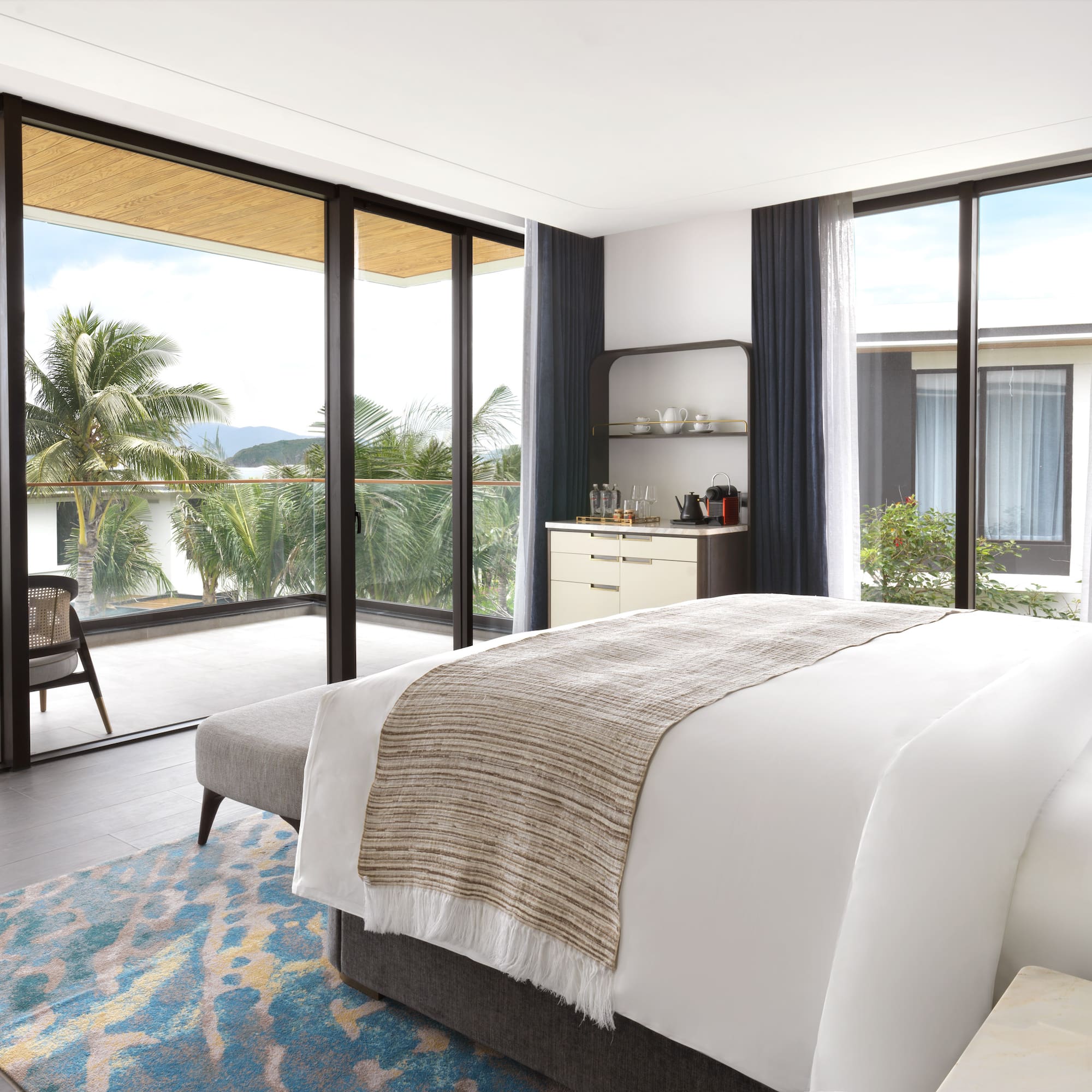 a bedroom with glass doors and a bed