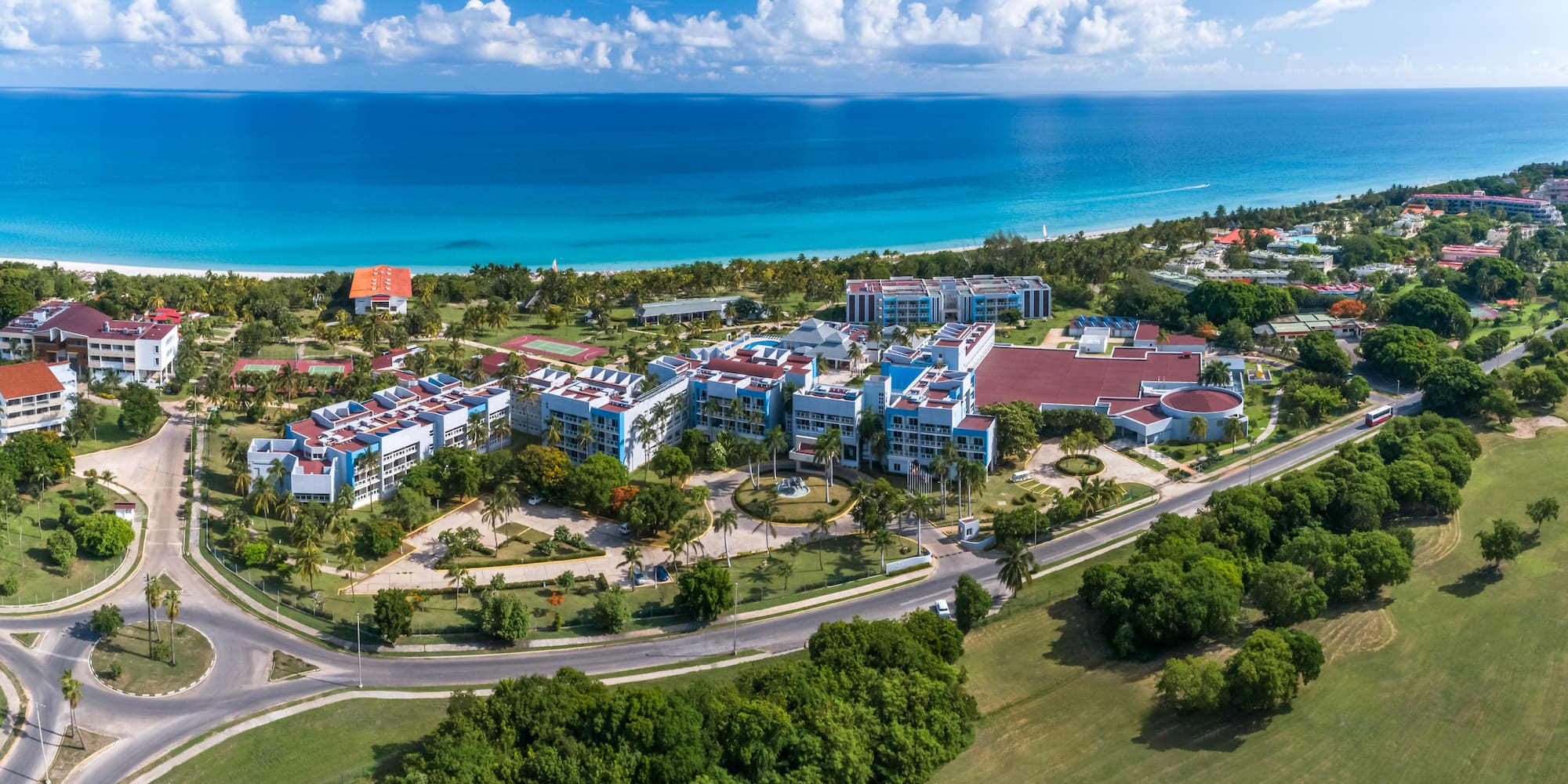 a group of buildings next to a body of water