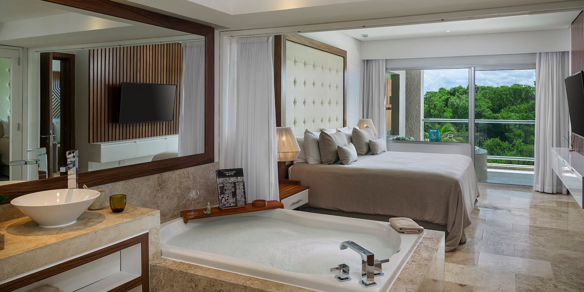 a room with a large tub and a bed