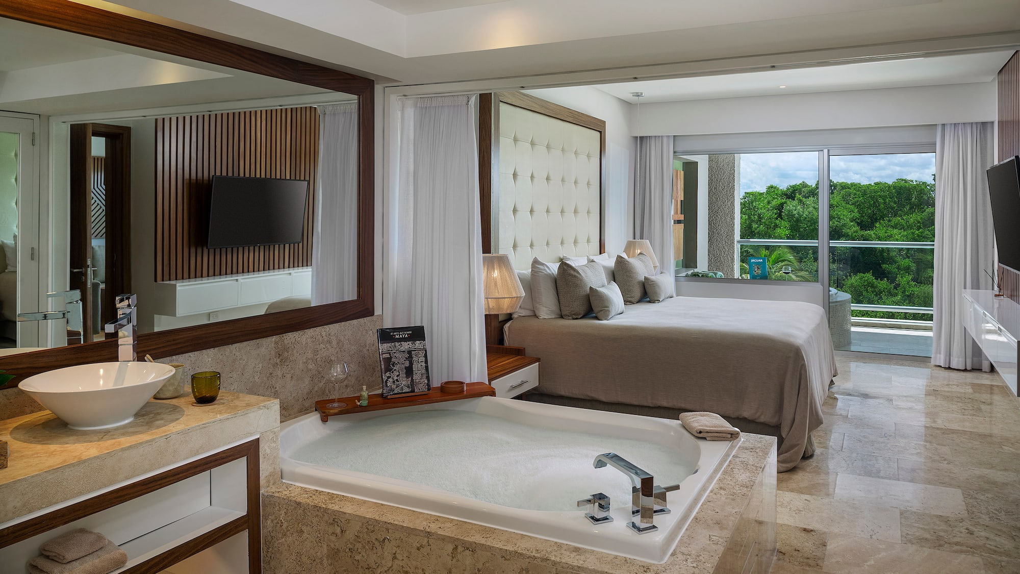 a room with a large tub and a bed