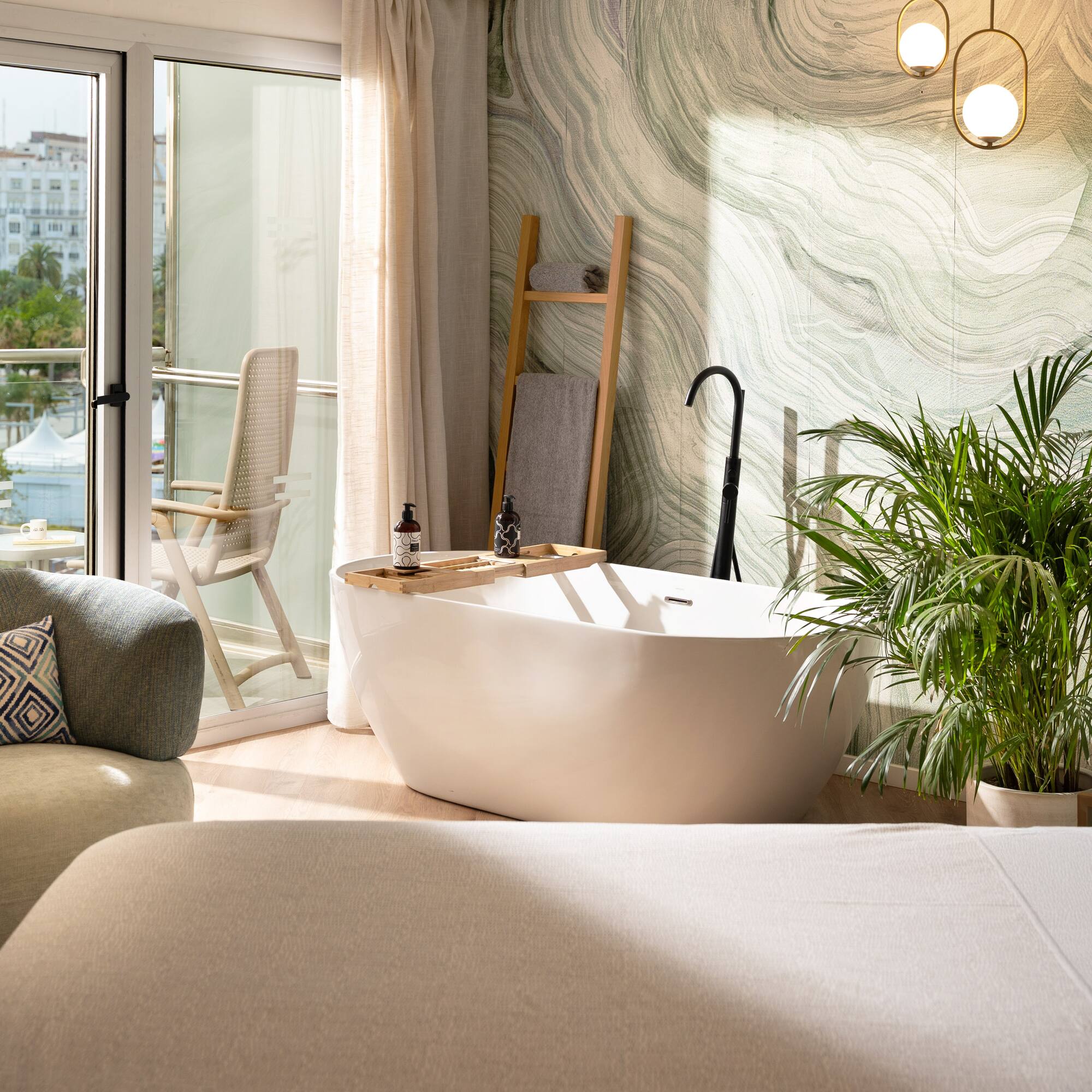 a room with a tub and a chair