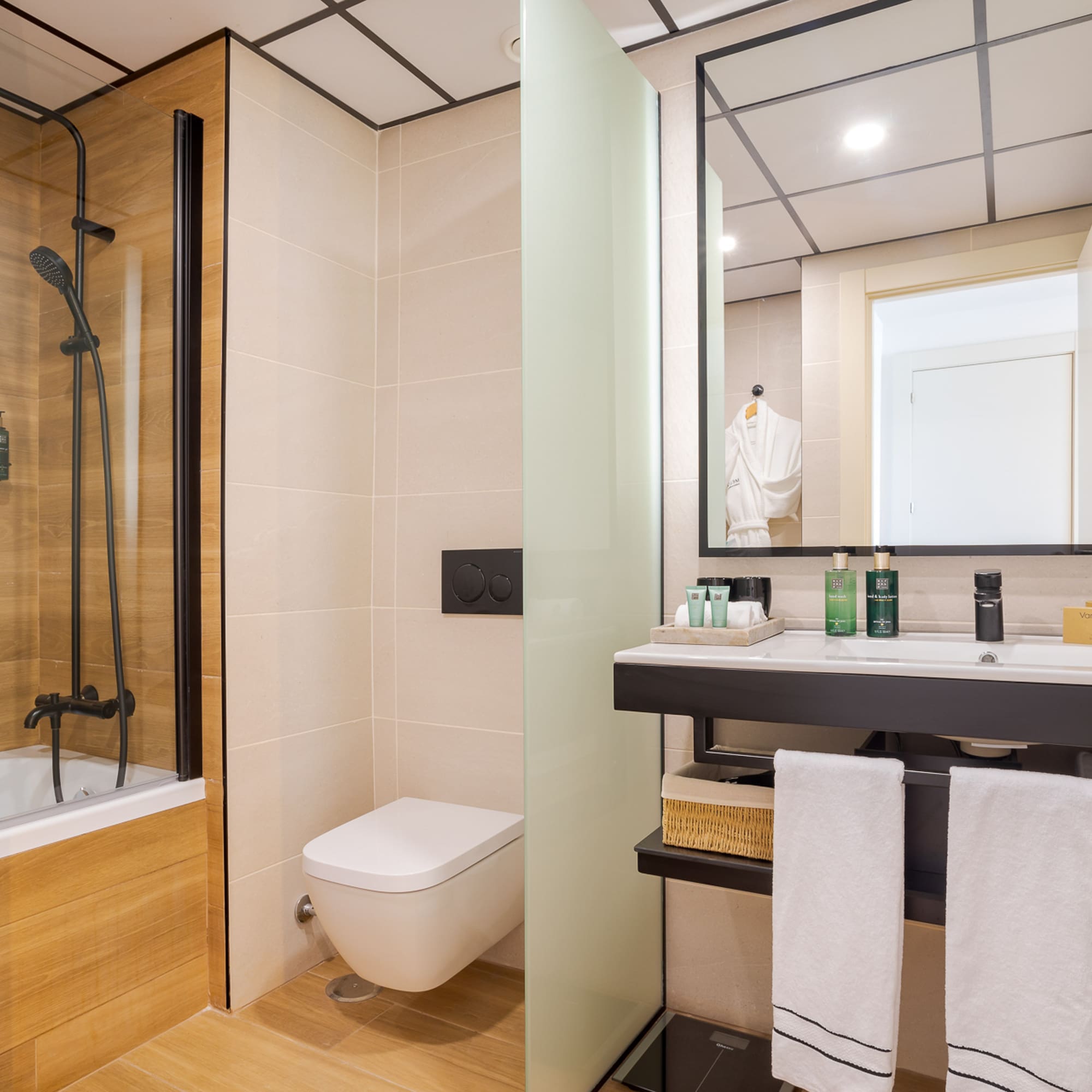 a bathroom with a shower and sink