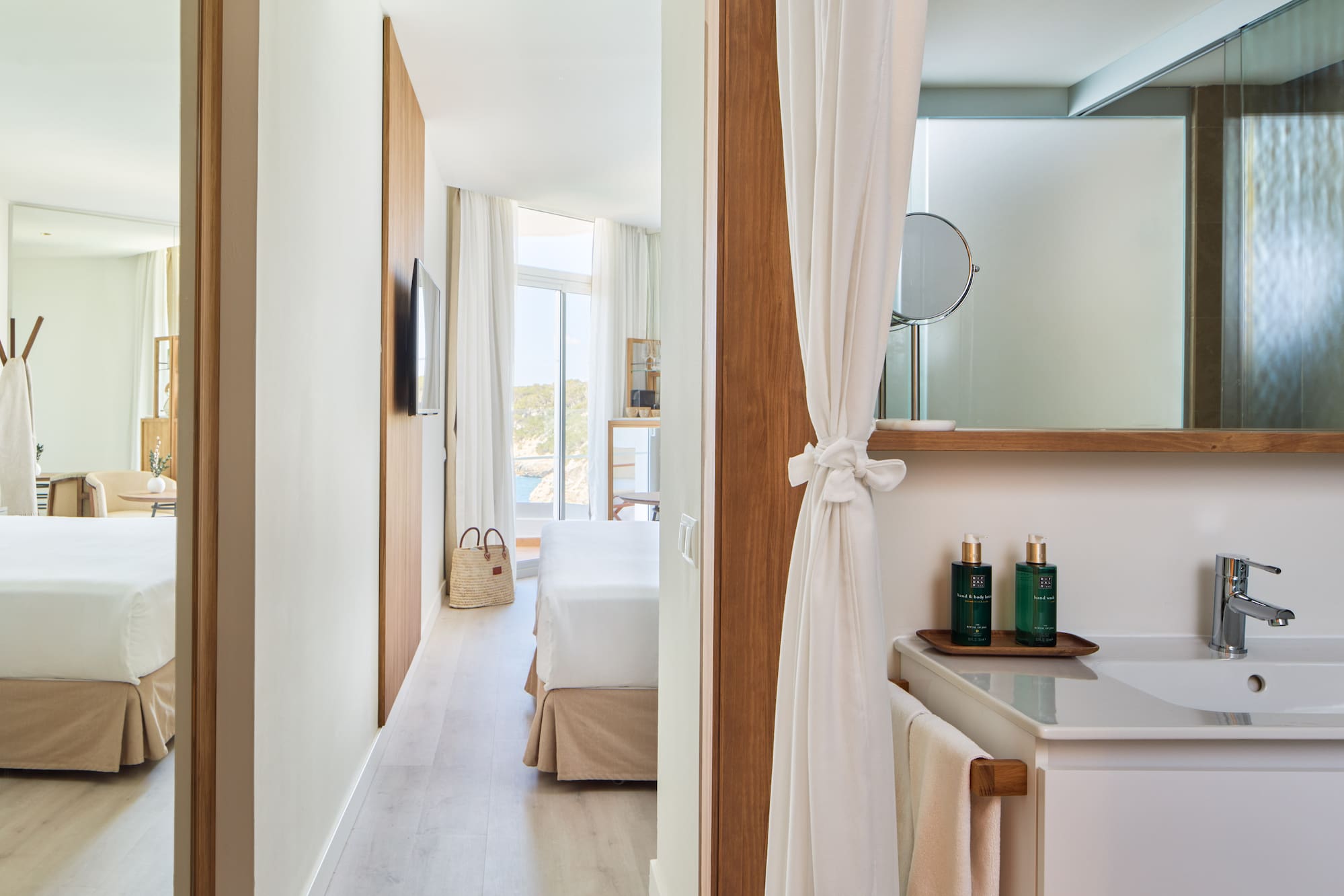 a room with a bed and a mirror