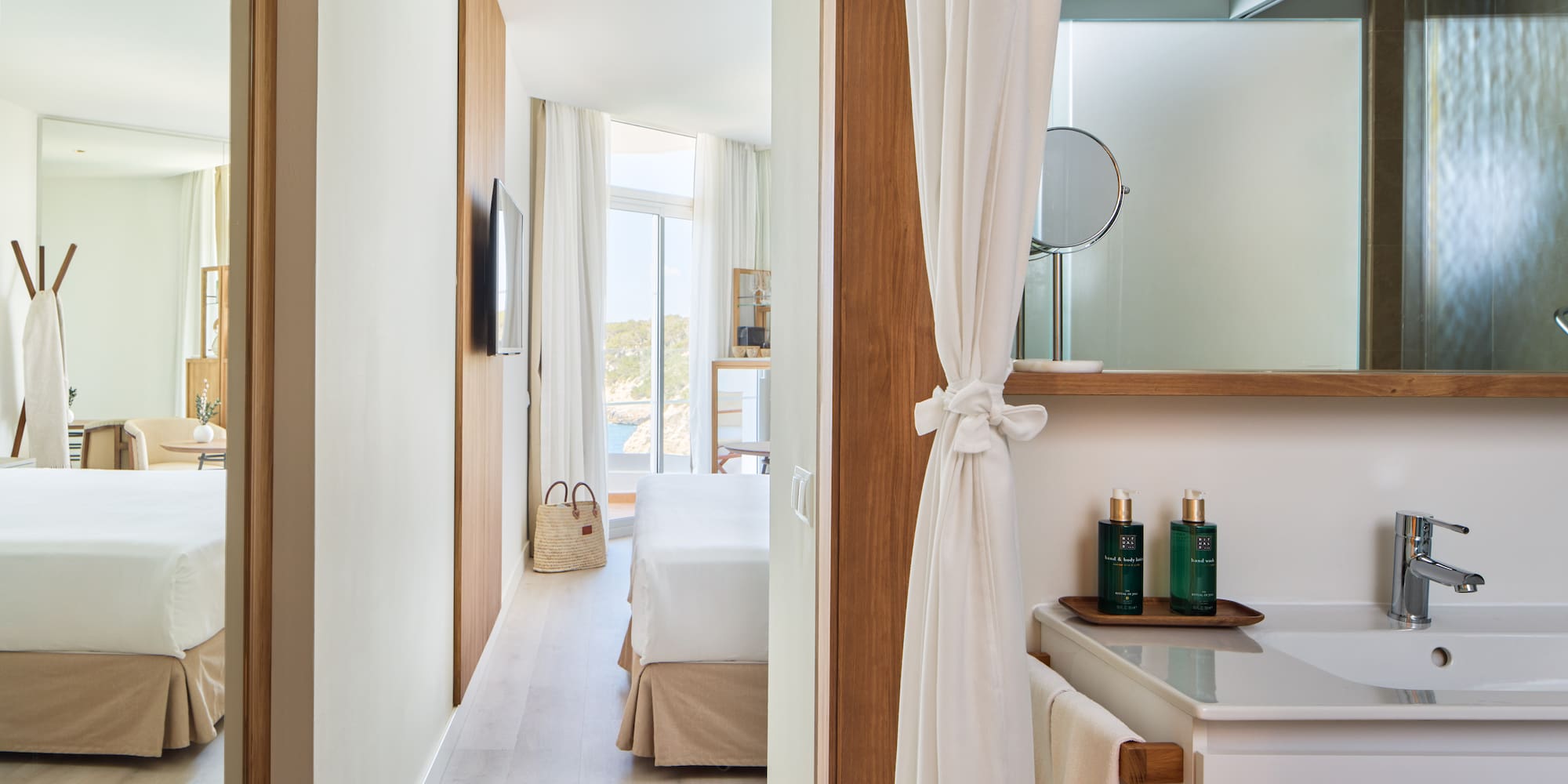 a room with a bed and a mirror