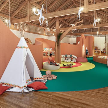 a room with a play area and a teepee