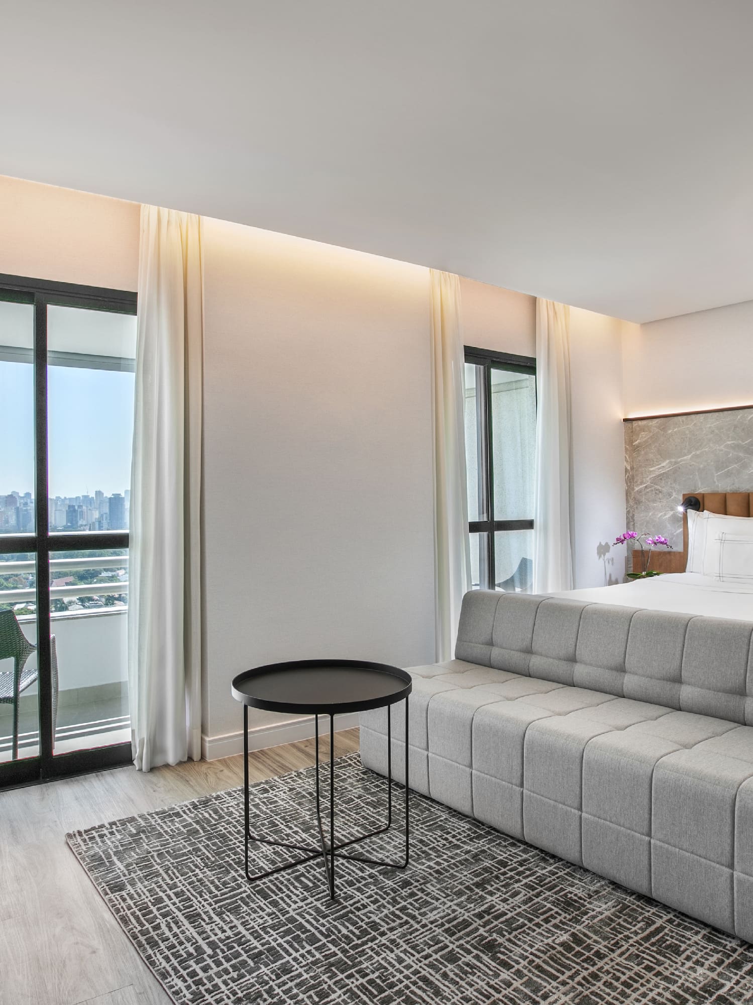 a room with a bed and a desk