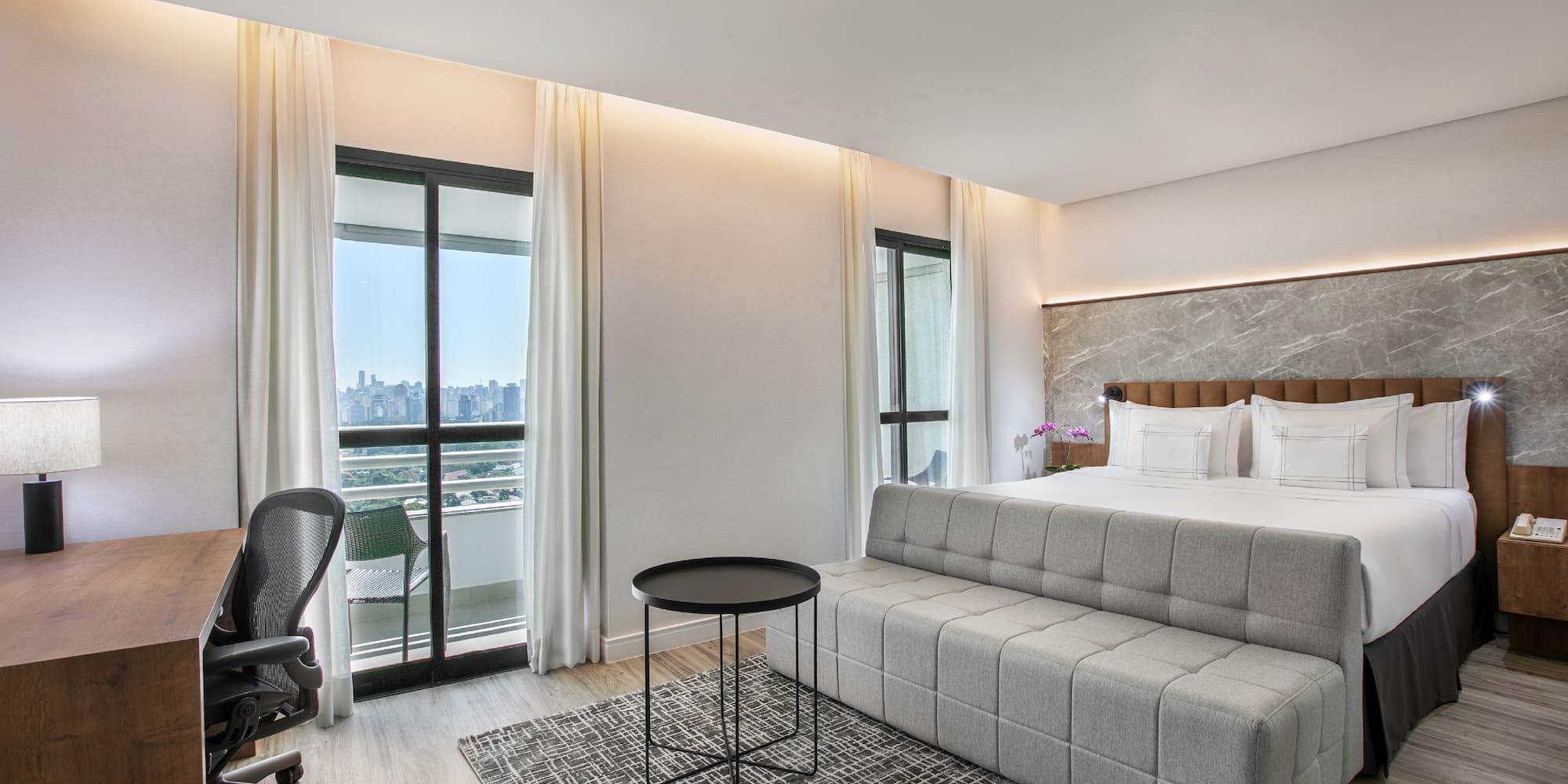 a room with a bed and a desk