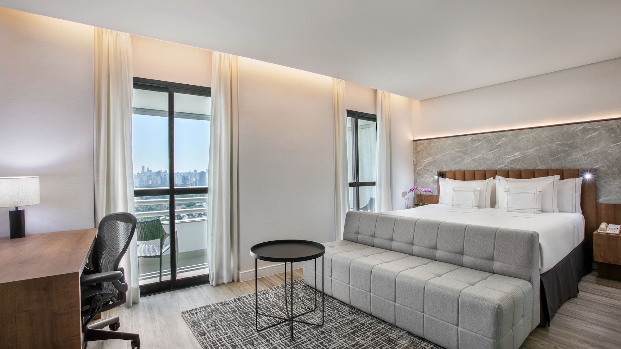 a room with a bed and a desk