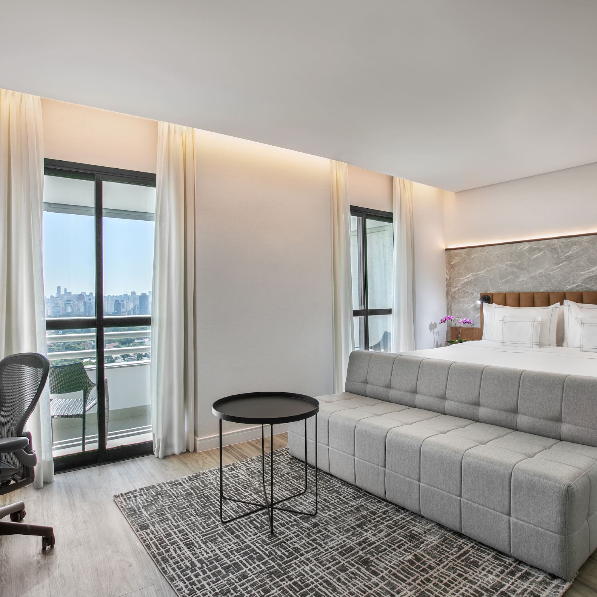 a room with a bed and a desk