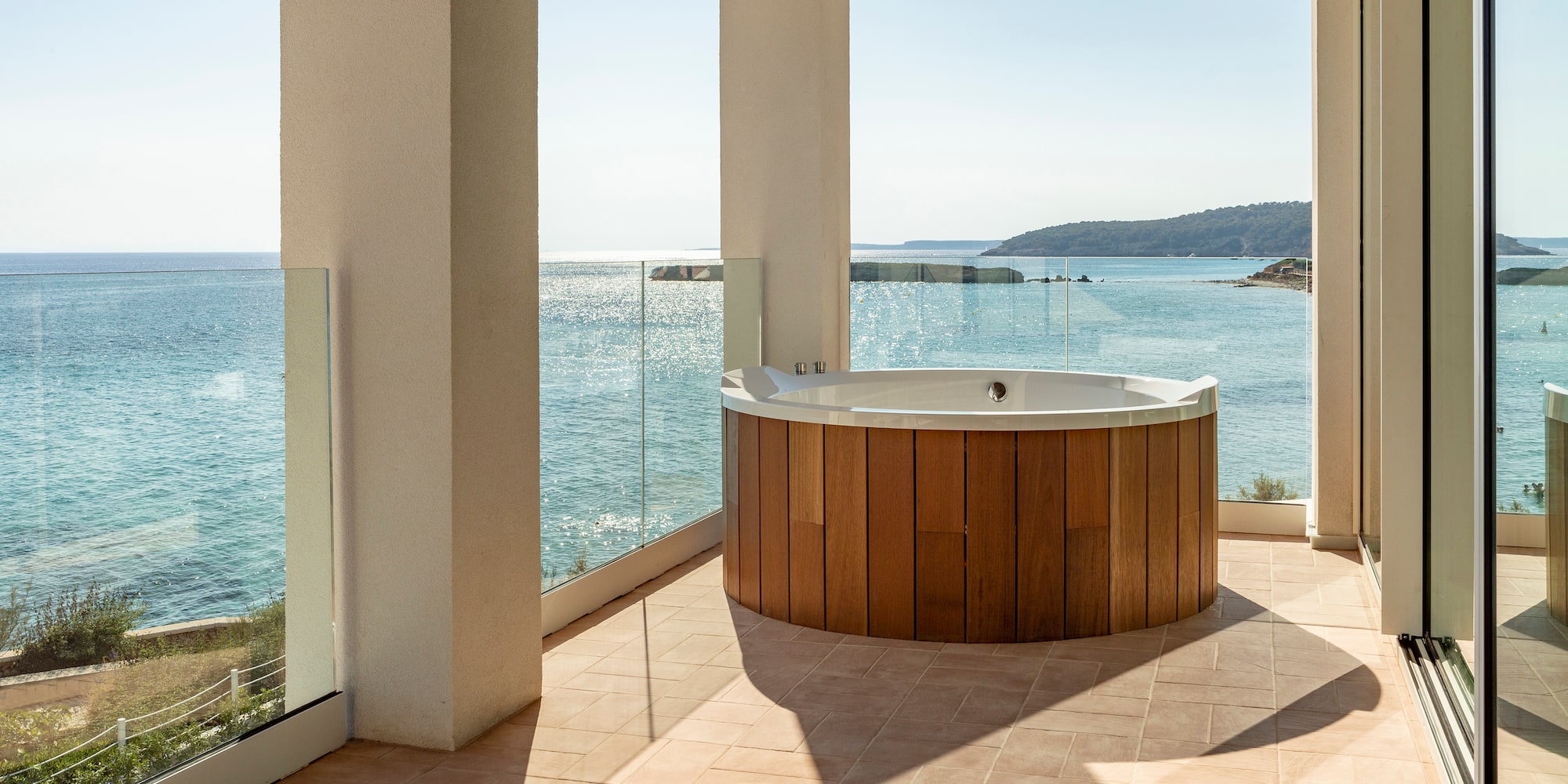 a hot tub with a view of the ocean