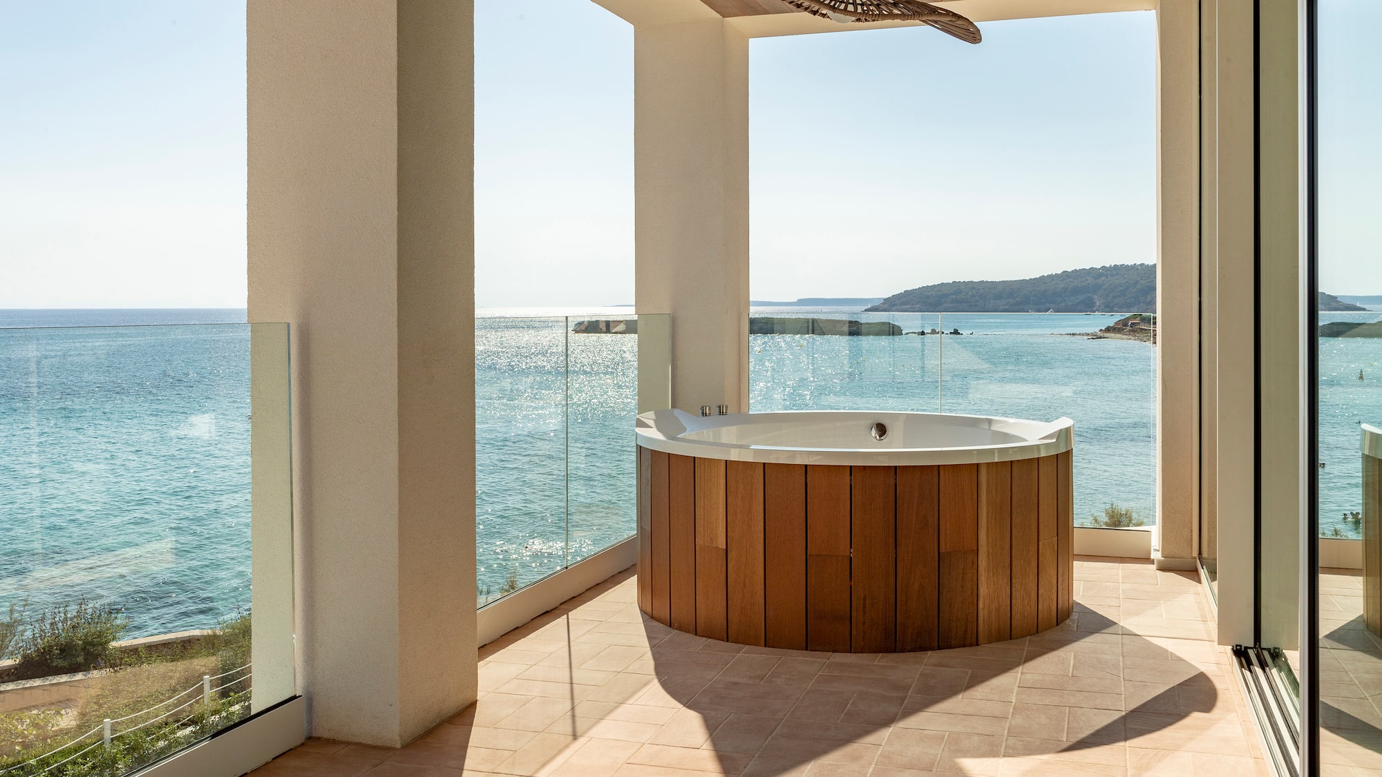 a hot tub with a view of the ocean