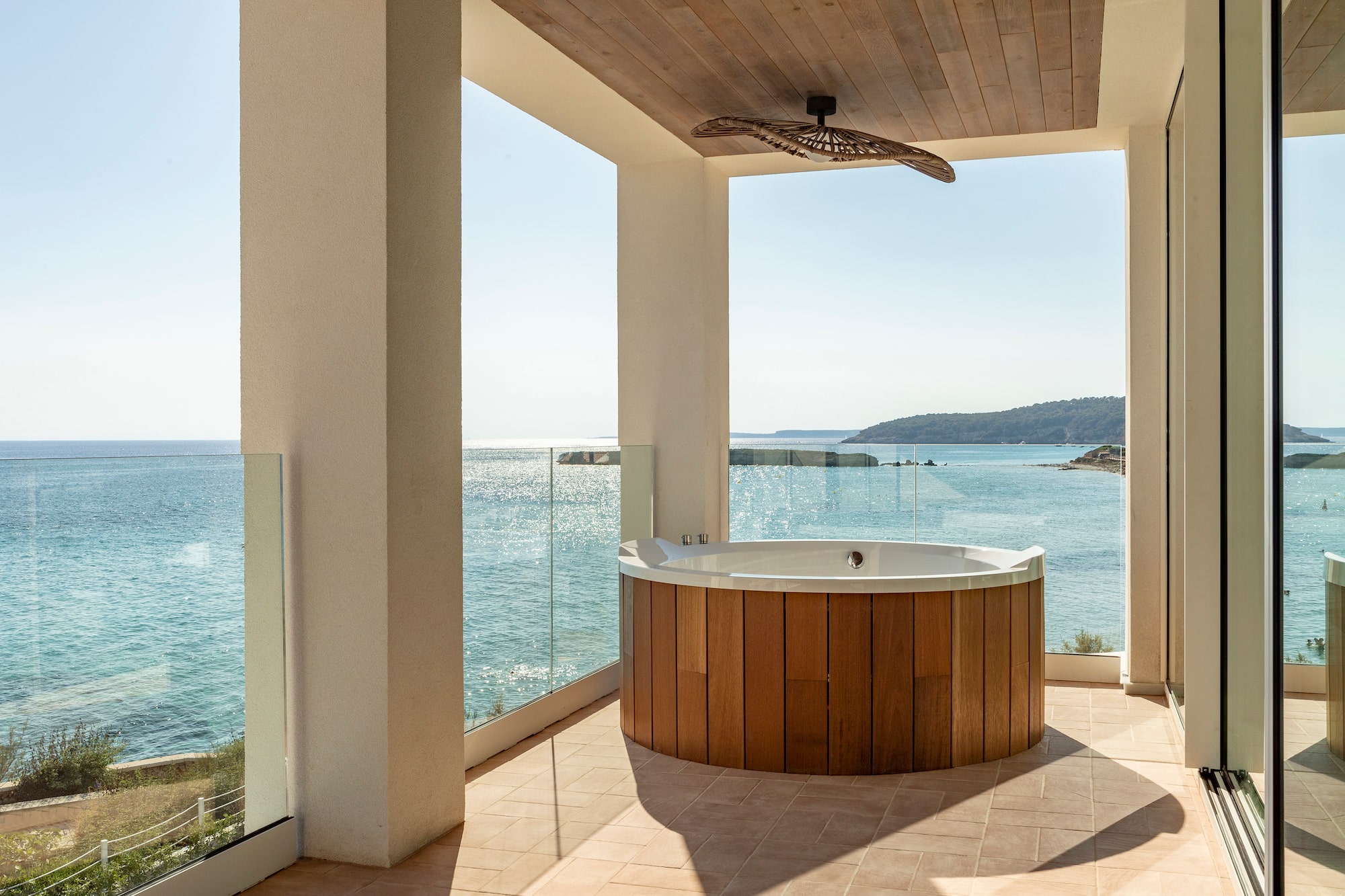 a hot tub with a view of the ocean