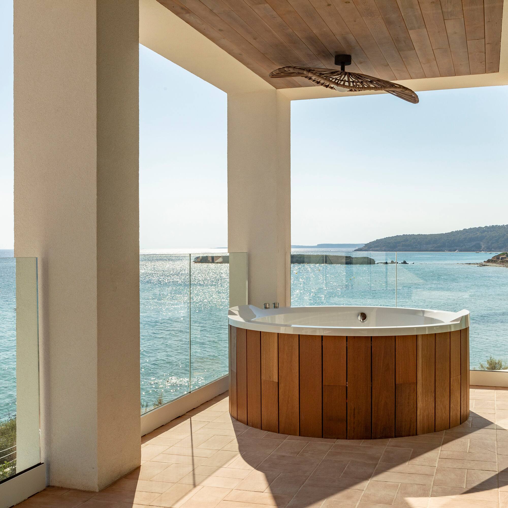 a hot tub with a view of the ocean