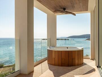 a hot tub with a view of the ocean
