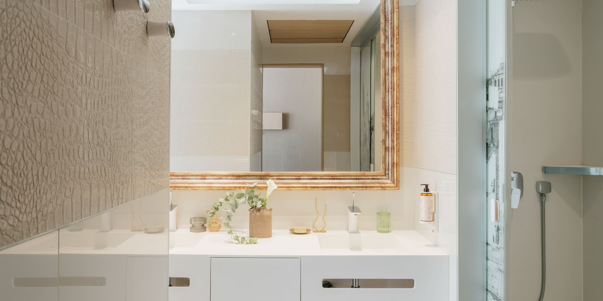 a bathroom with a mirror and sink