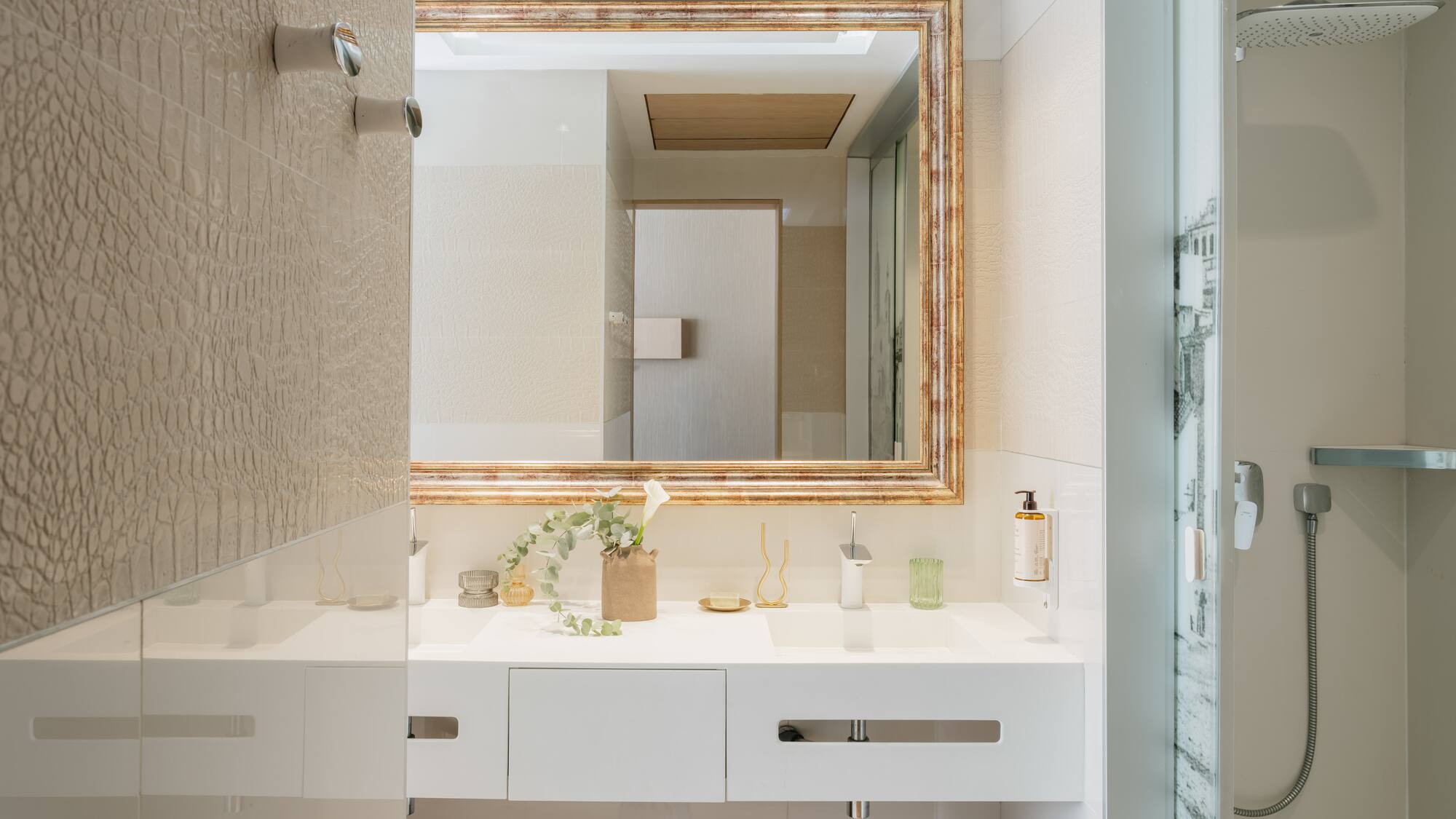a bathroom with a mirror and sink
