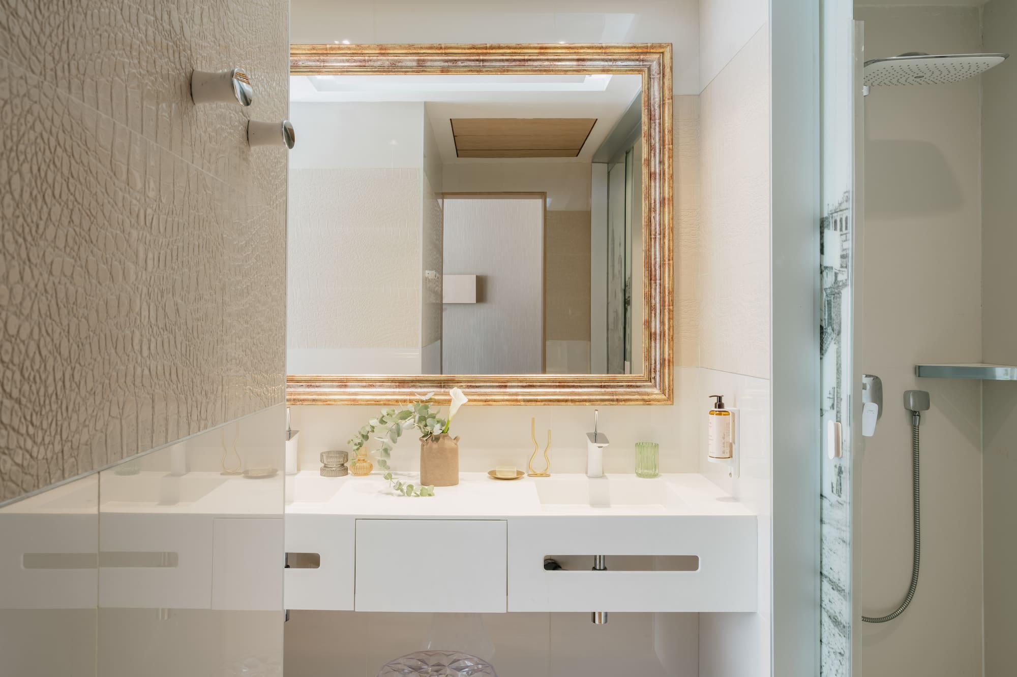 a bathroom with a mirror and sink