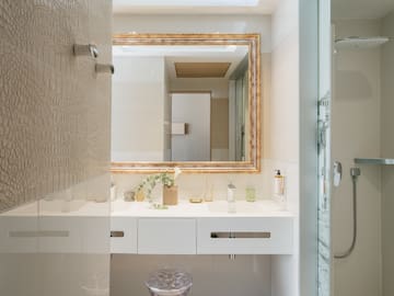 a bathroom with a mirror and sink