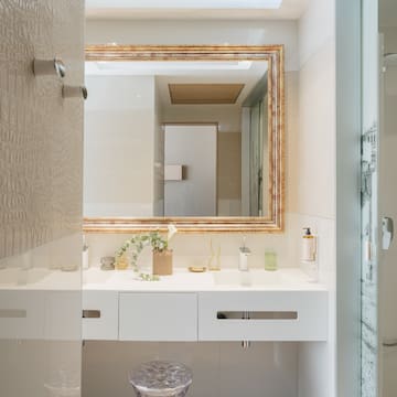 a bathroom with a mirror and sink
