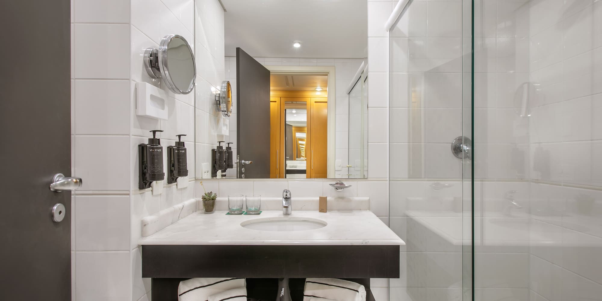 a bathroom with a mirror and a sink