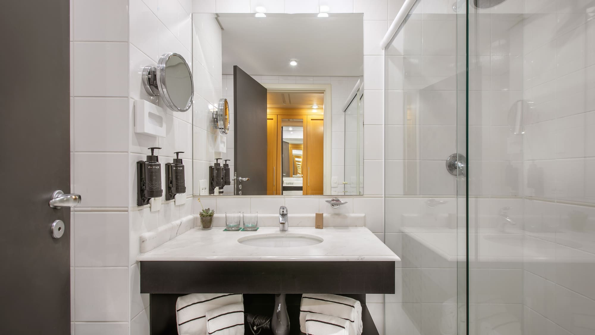 a bathroom with a mirror and a sink