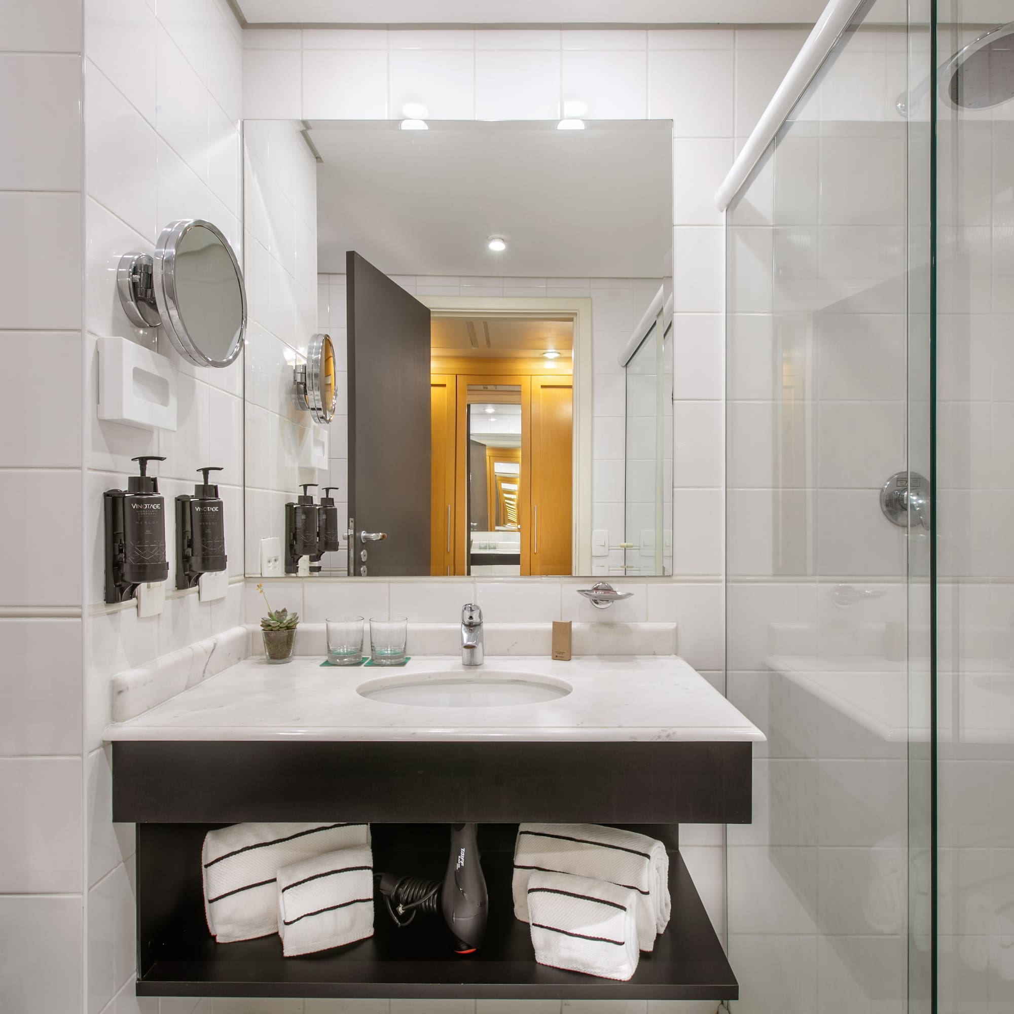 a bathroom with a mirror and a sink