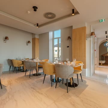 a room with tables and chairs