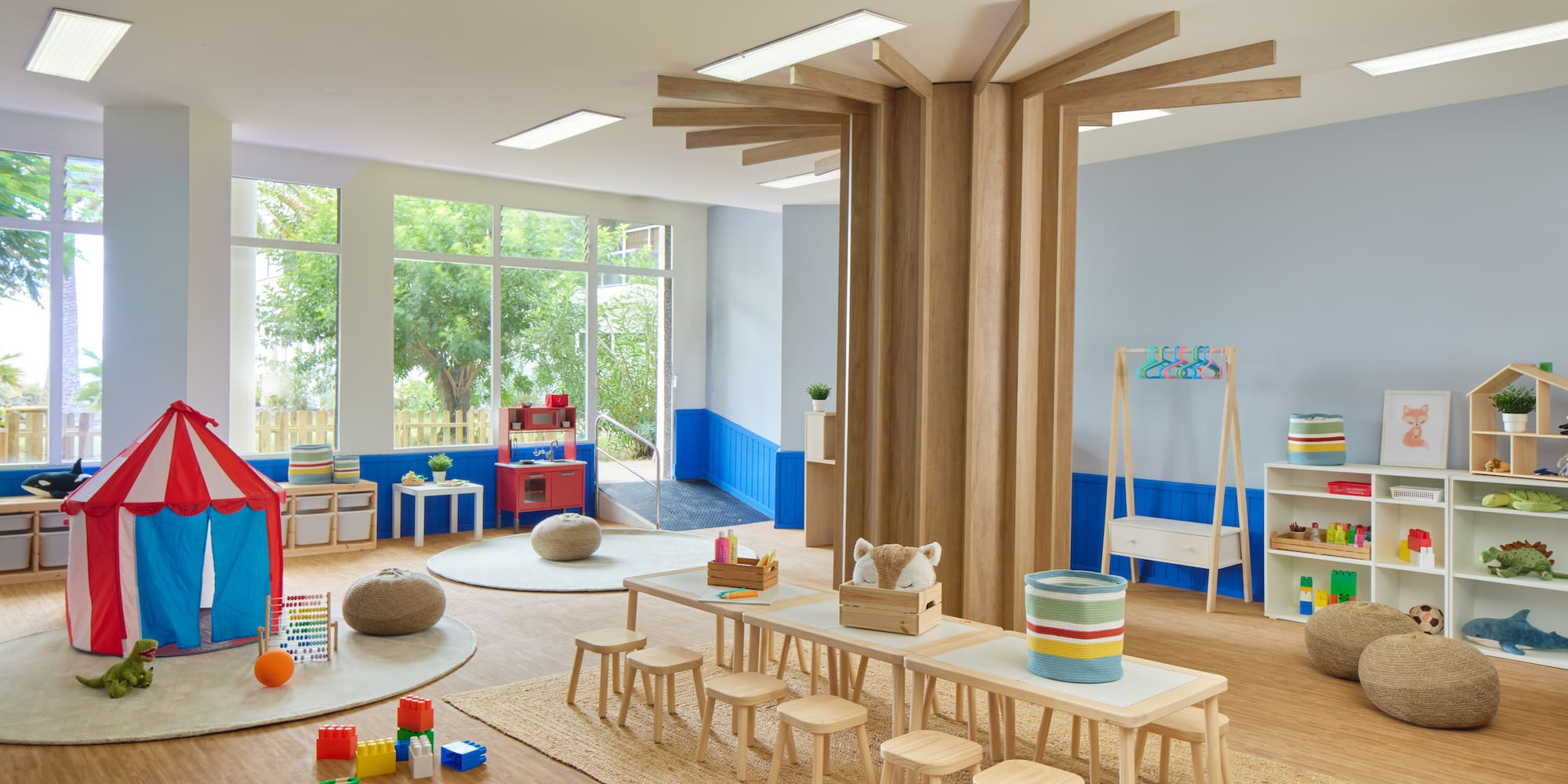 a room with a table and chairs and toys