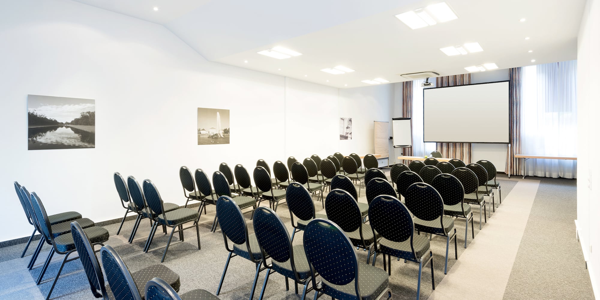 a room with rows of chairs