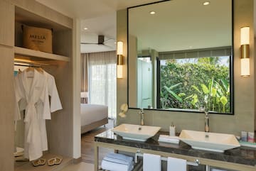 a bathroom with a large mirror and two sinks