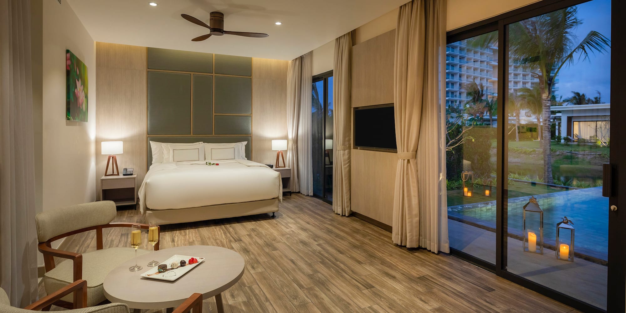 a room with a bed and a pool in the background