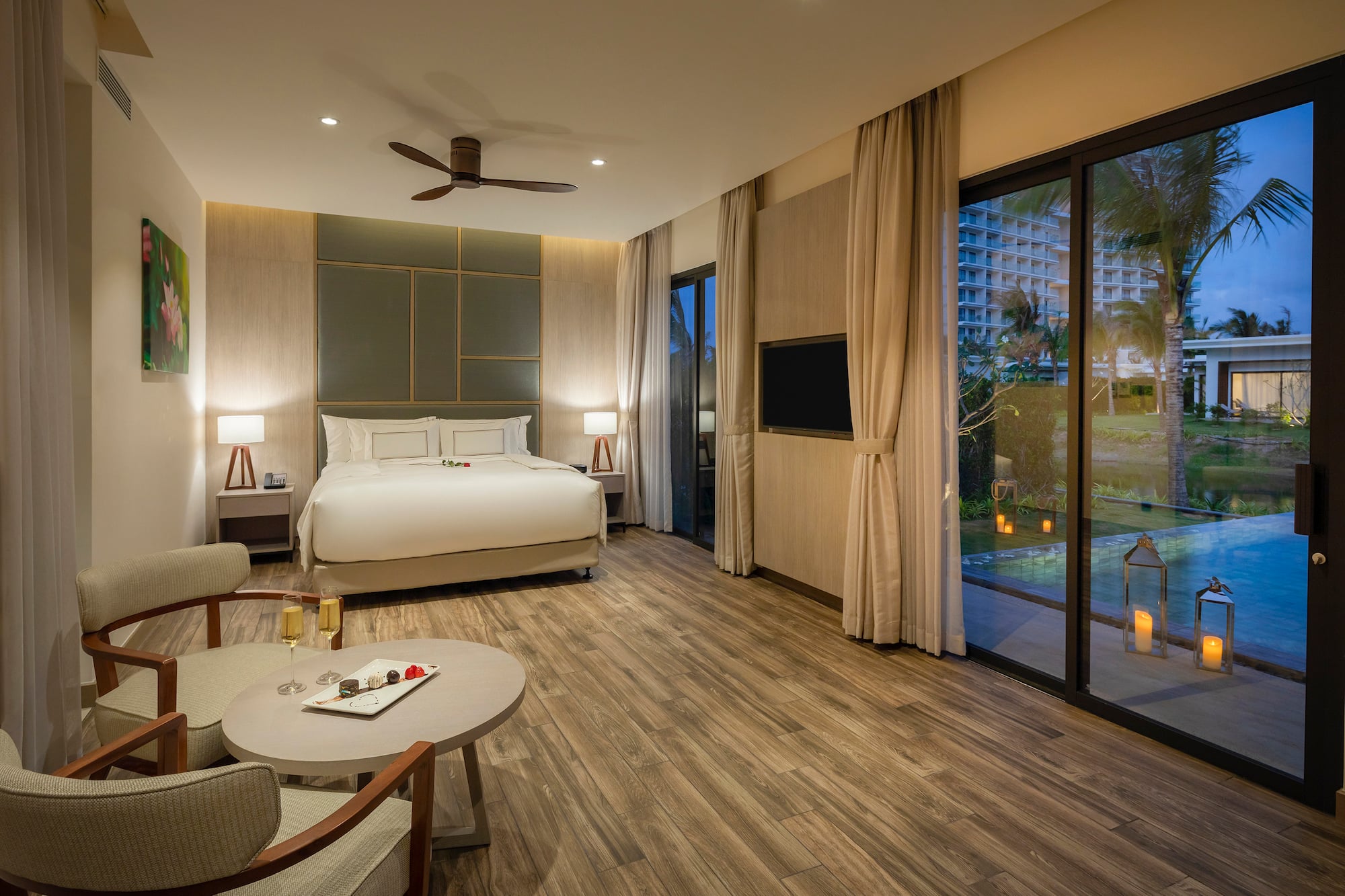 a room with a bed and a pool in the background