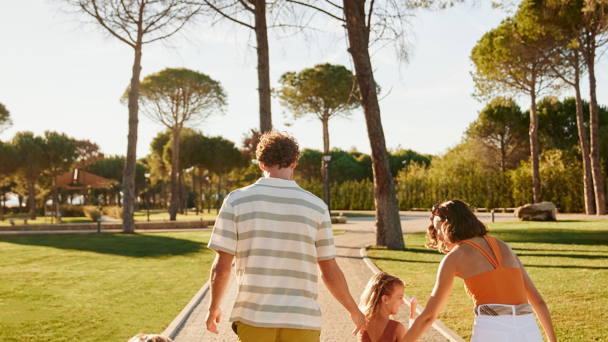 a group of people walking on a path