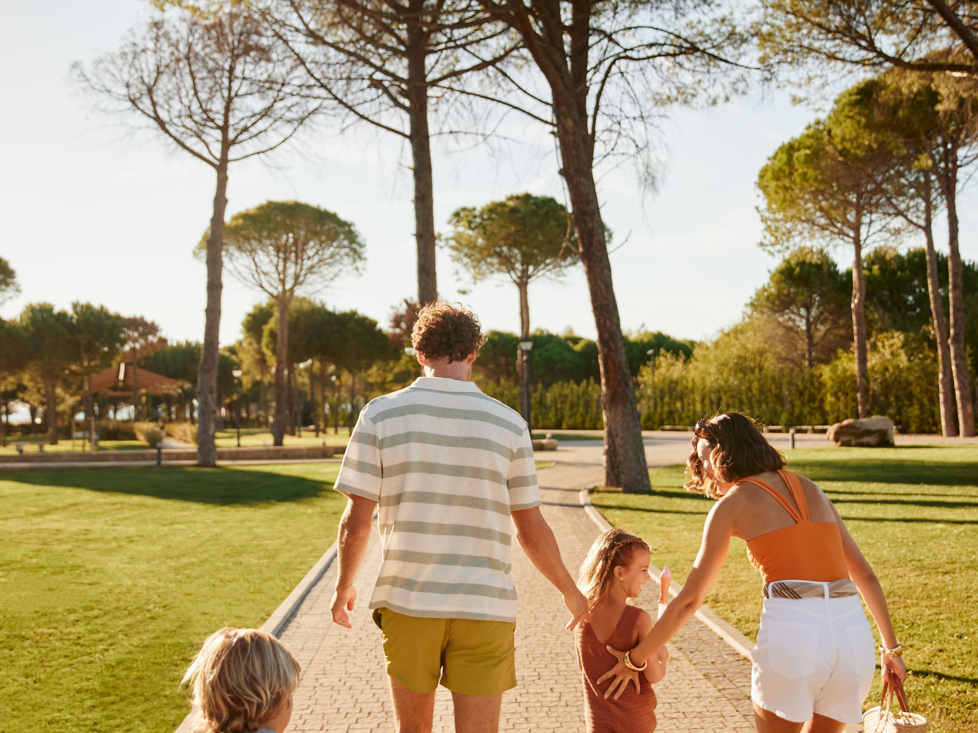 a group of people walking on a path