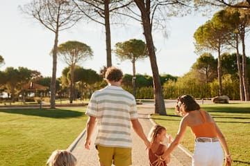 a group of people walking on a path