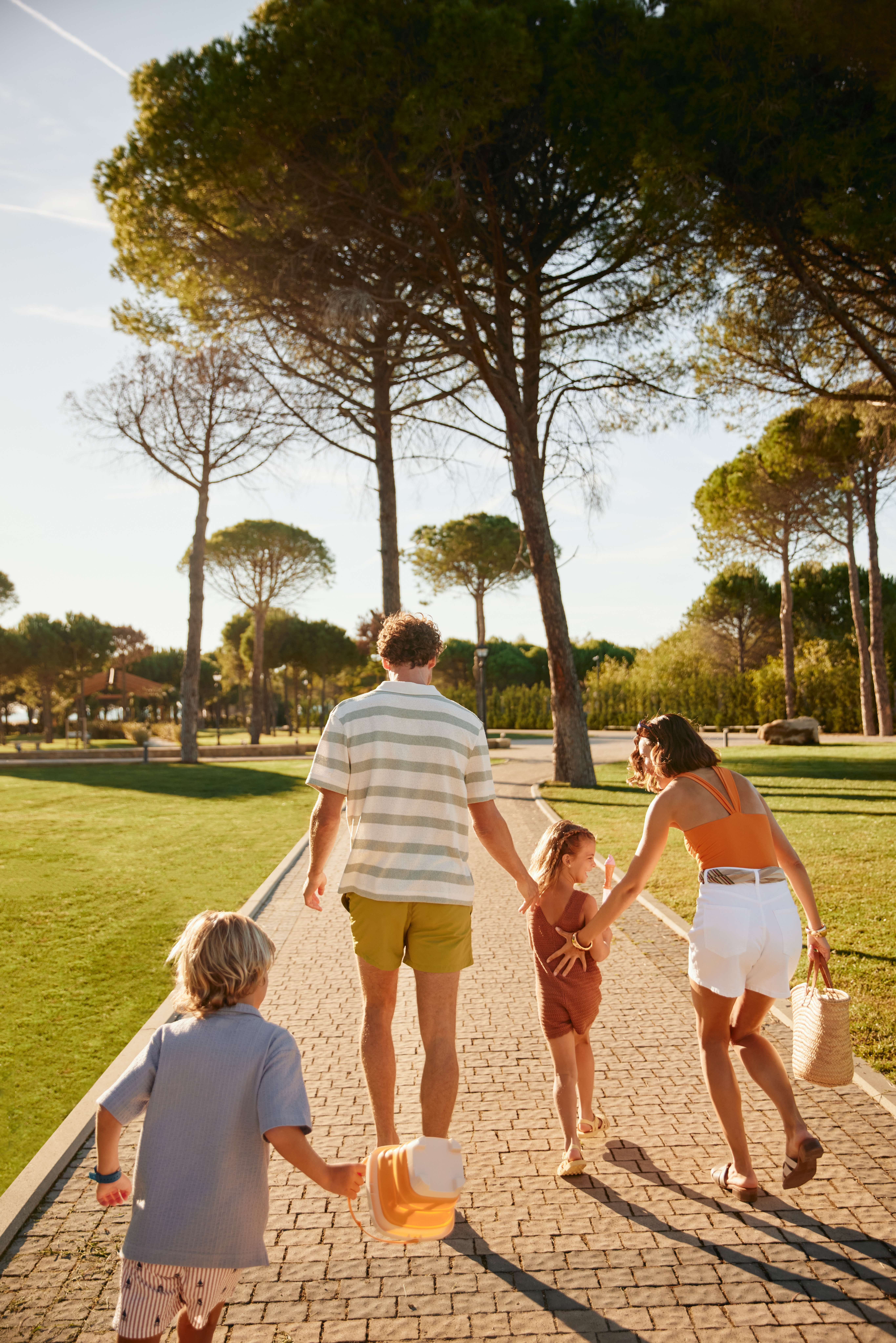 a group of people walking on a path