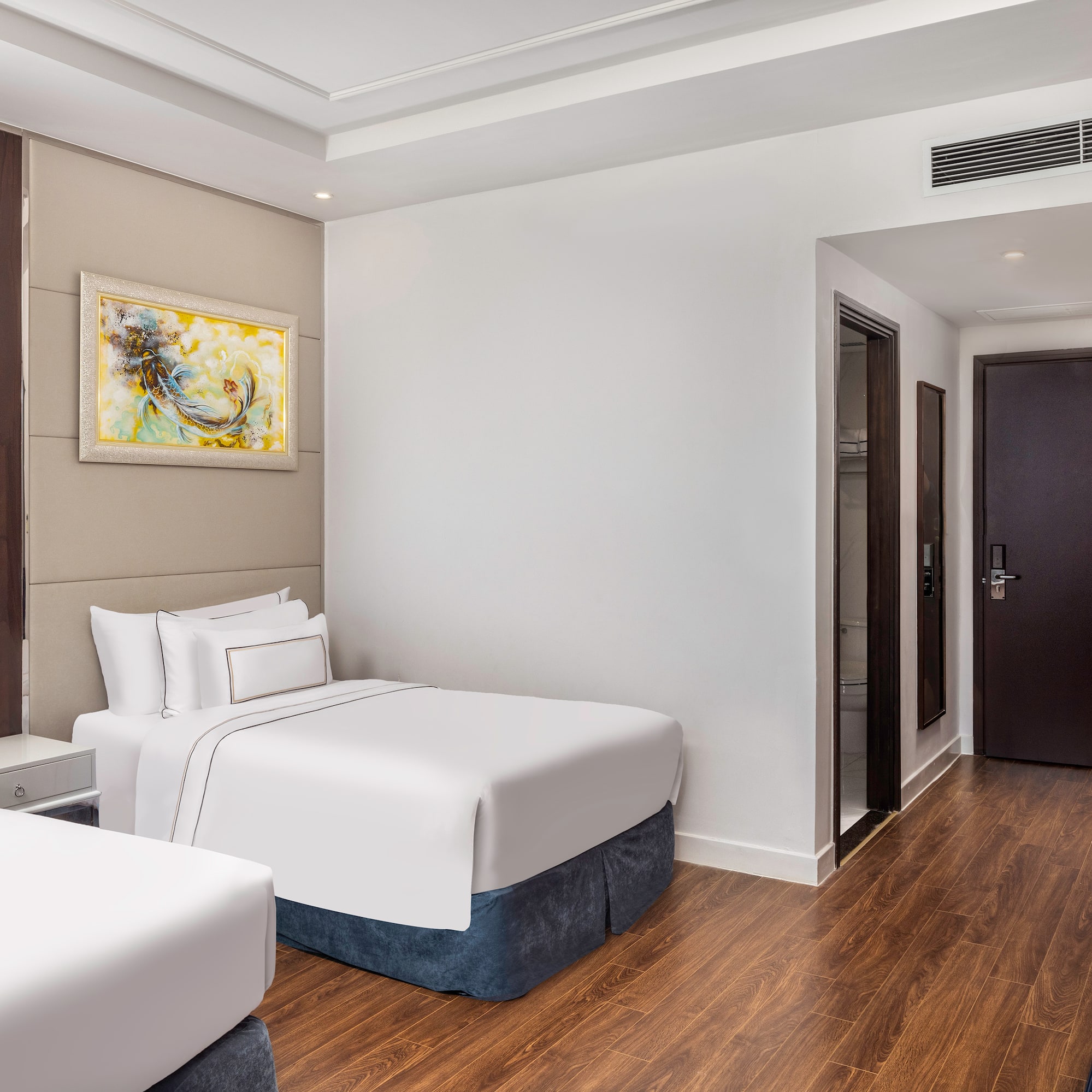 a room with two beds and a door