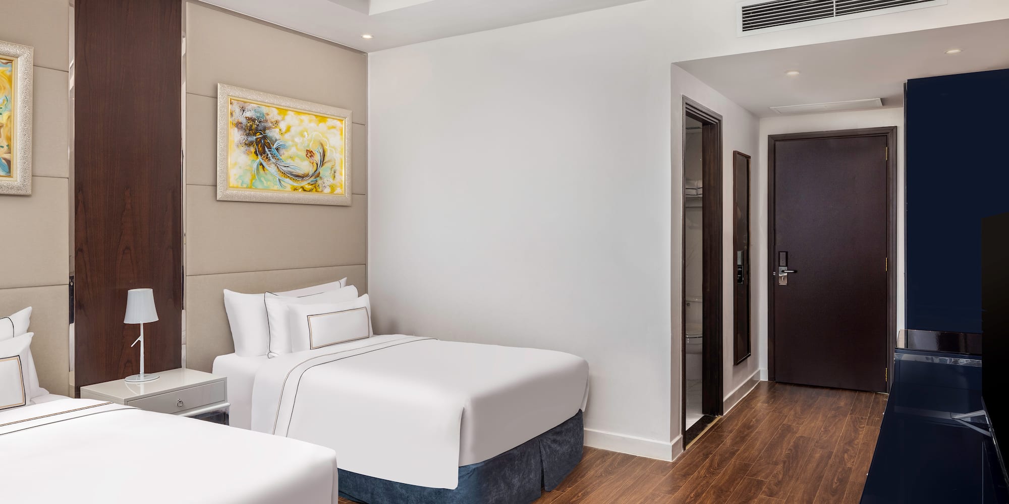 a room with two beds and a door