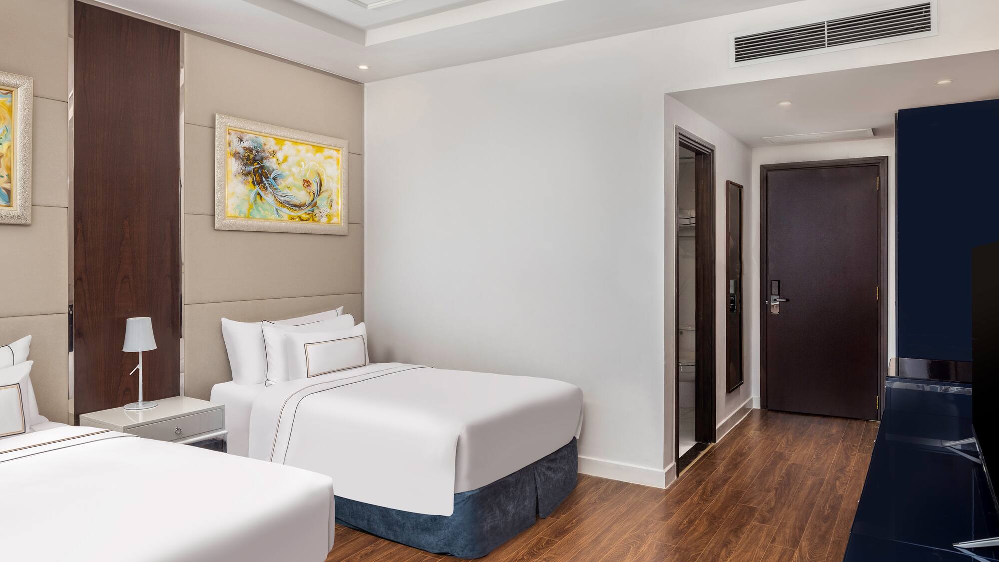 a room with two beds and a door