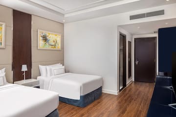 a room with two beds and a door