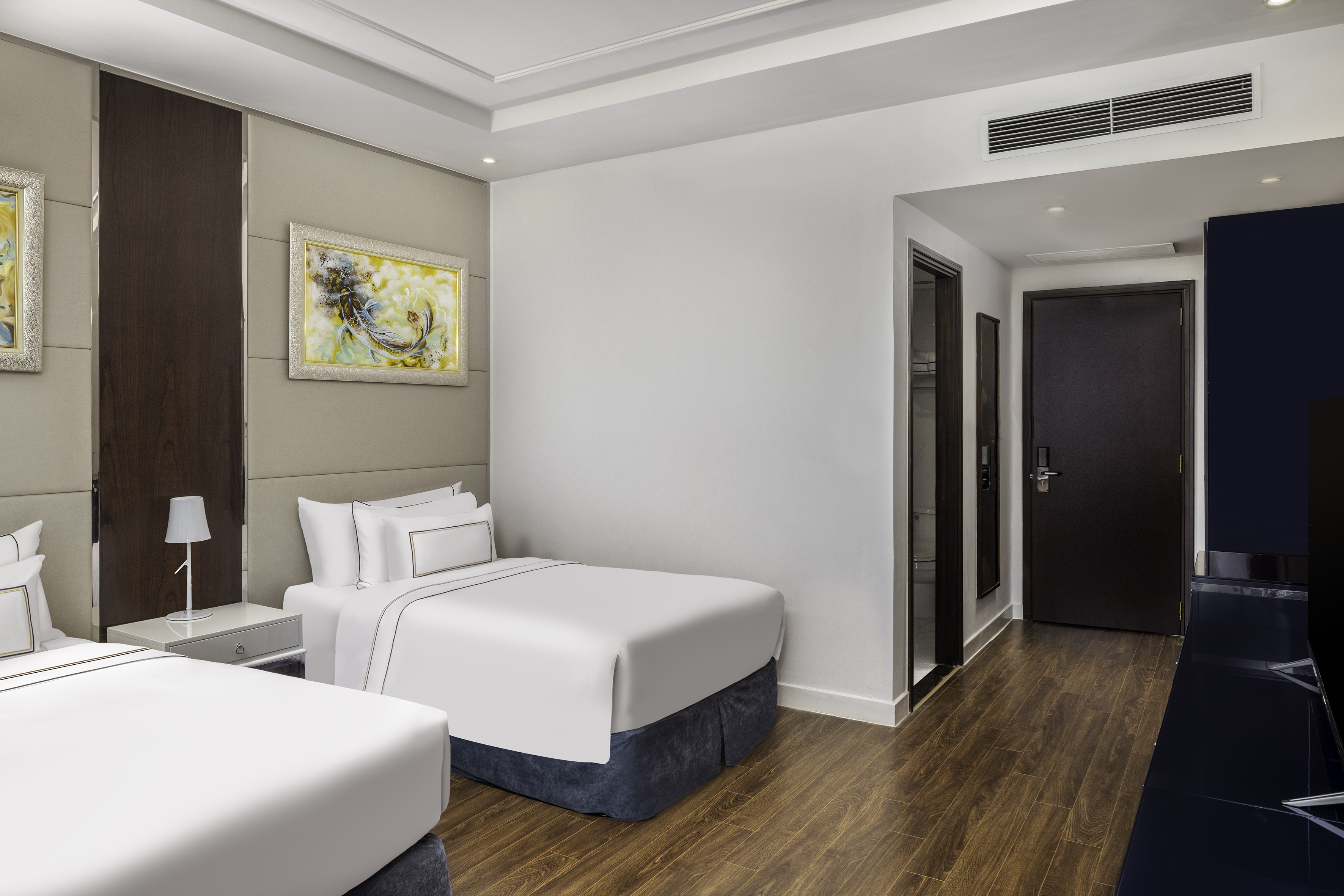 a room with two beds and a door