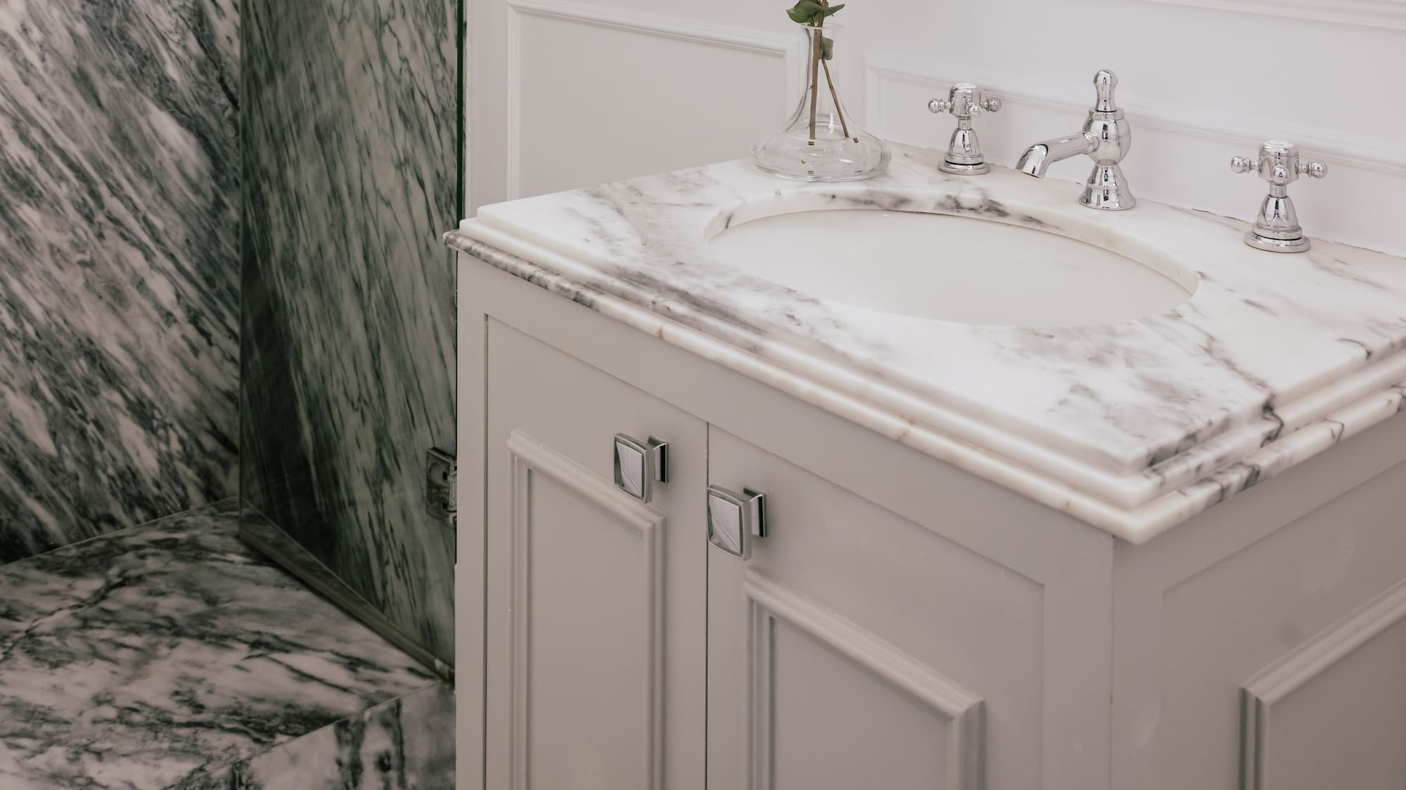 Luxury bathroom with marble shower, white vanity, mirror, and chrome faucet. - Cosy Room - MiM Ibiza Meliá Collection, Ibiza