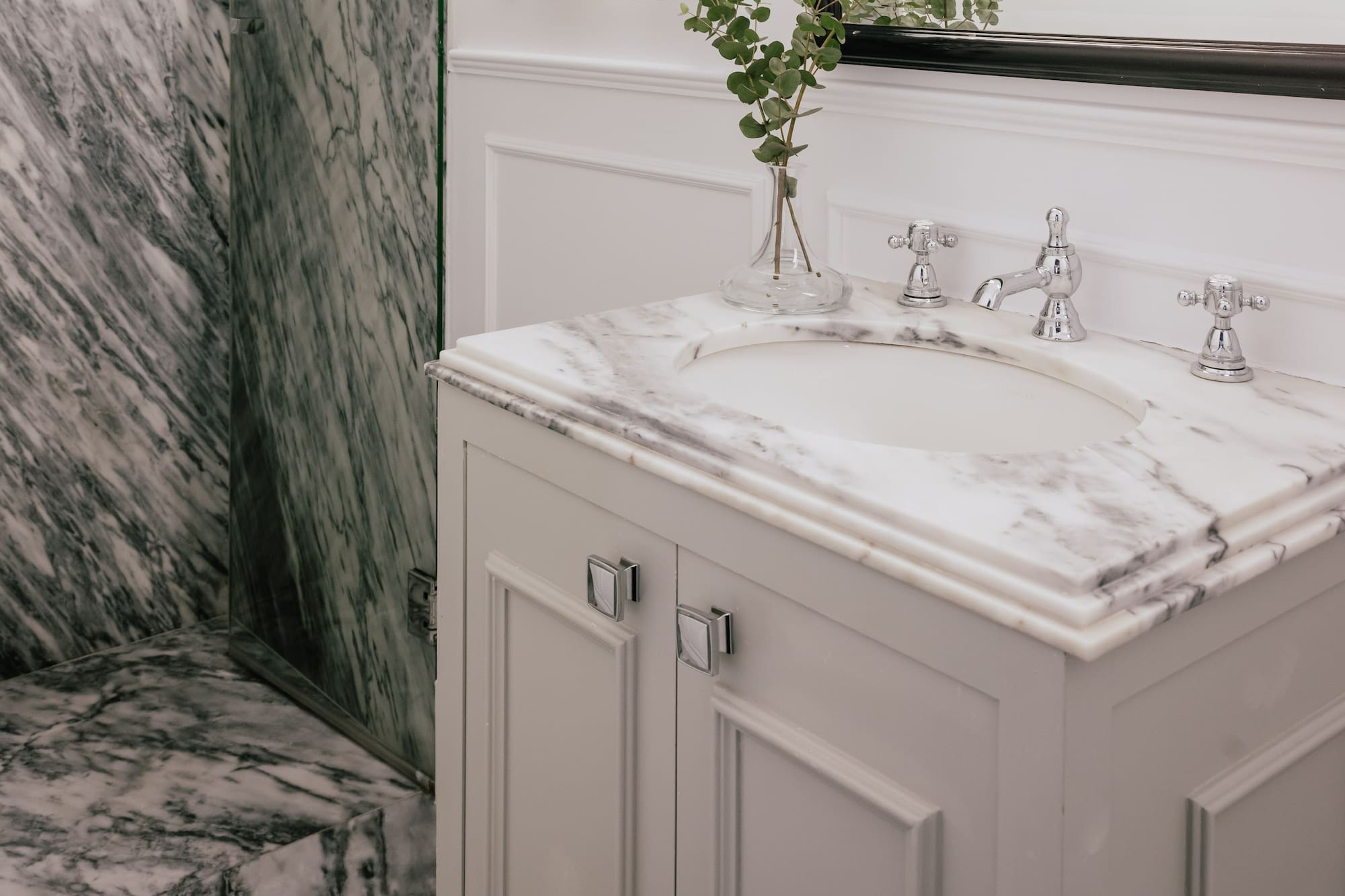 Luxury bathroom with marble shower, white vanity, mirror, and chrome faucet. - Cosy Room - MiM Ibiza Meliá Collection, Ibiza